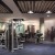 large, open fitness center with ample lighting throughout